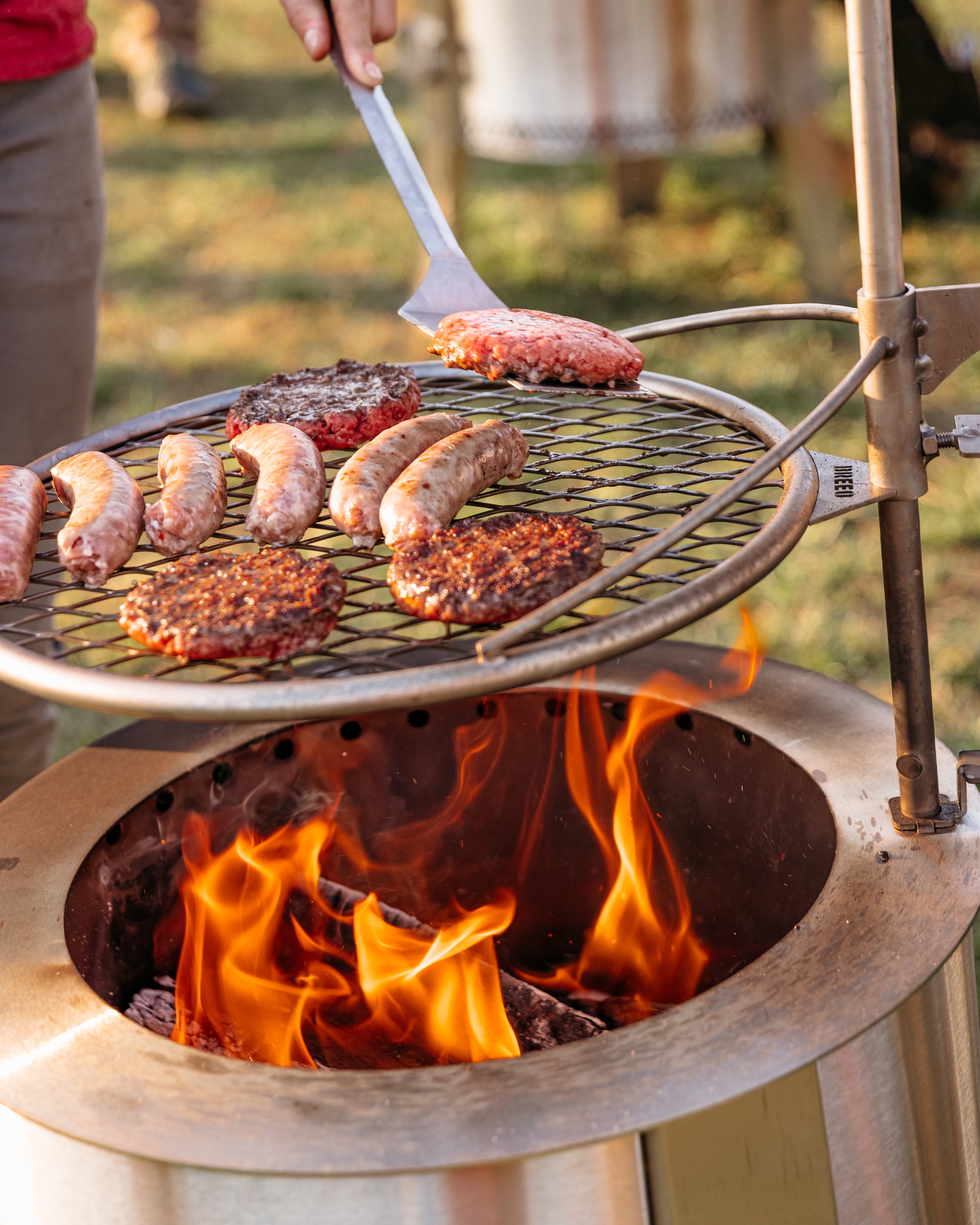 Meat cooking on fire pit