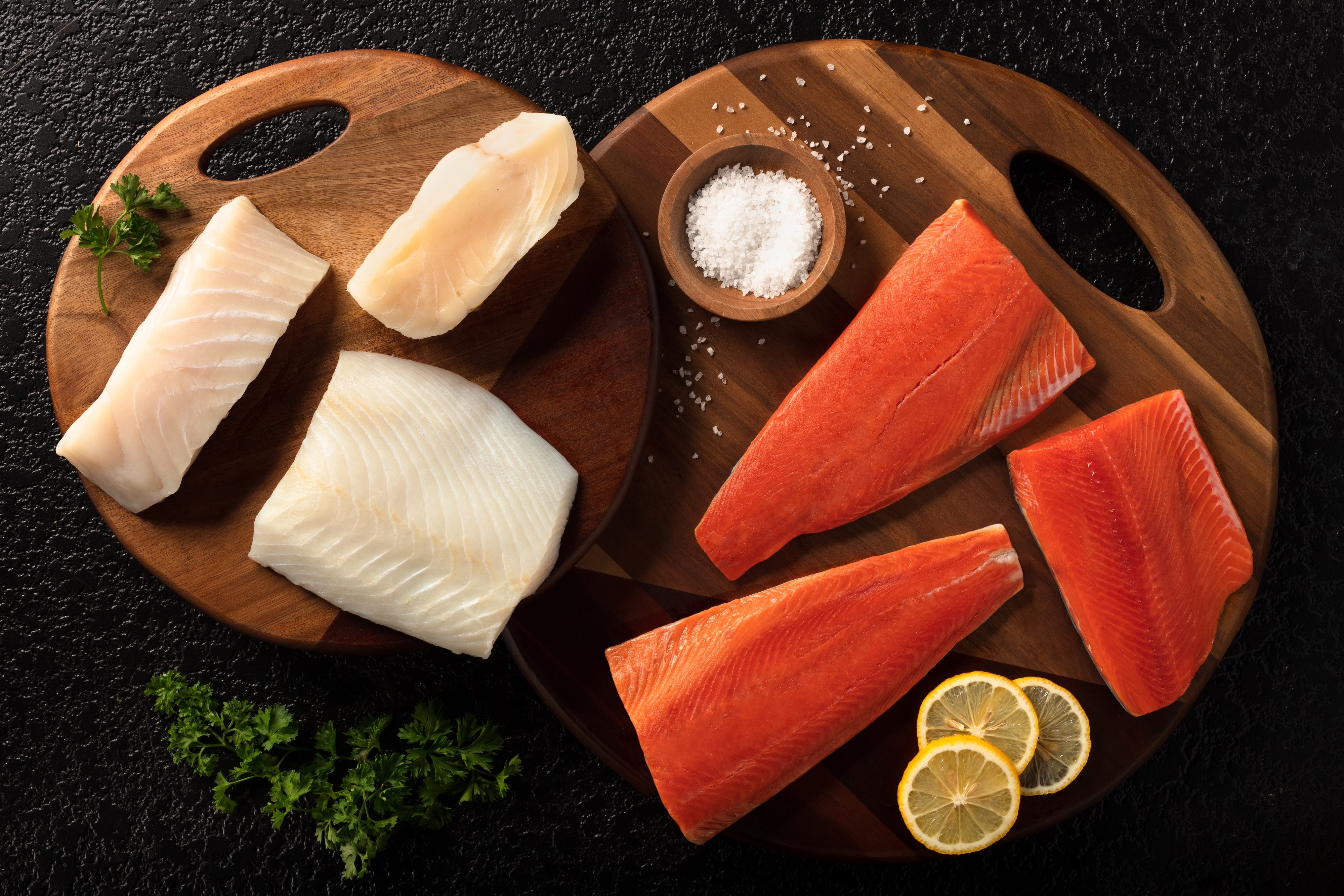 raw fish on cutting boards